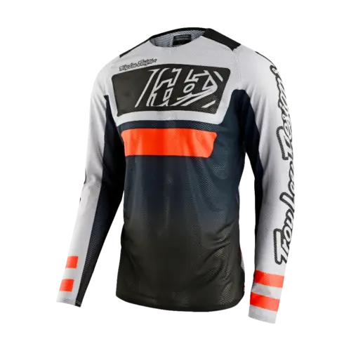 Troy Lee Designs SE Pro Air Lanes мотокрос джърси в черен, сив и оранжев цвят на бял фон